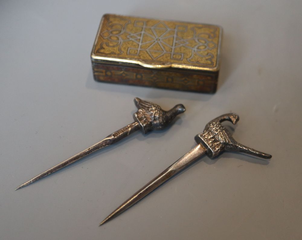 A 19th century damascened iron vesta case and two bird skewers